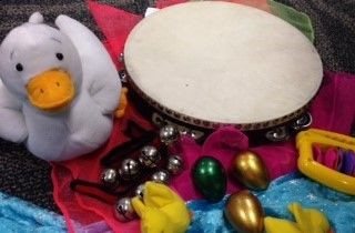 A toy duck and a tambourine