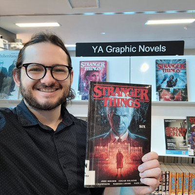 Librarian Stephan holds a copy of Stranger Things