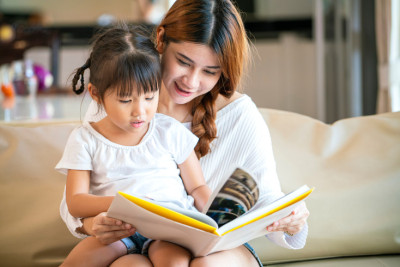 A mother and child reading together