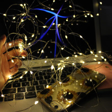Fairy lights in front of a laptop