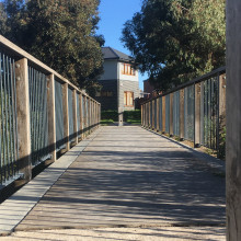 A footbridge leads to a house