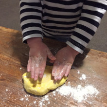child making yellow playdough