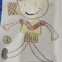 A child's drawing of a child playing football