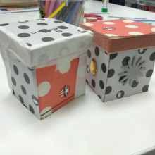 2 decorated paper boxes