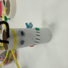 A soccer robot made from a toilet roll
