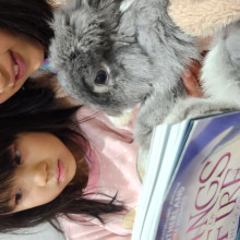 Kay Sie and Kae Lyn reading to Eeyorey