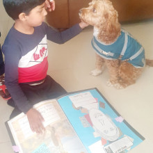  Kiyaan reading to Bella