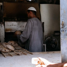 Morning queue for fresh bread by Brandon Kim