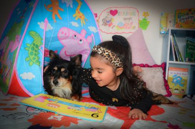 Gursheen reads to her pet Bruno
