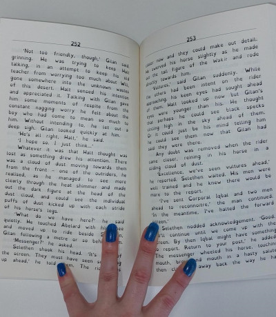 A book held open to show text set in Dyslexie, a dyslexic friendly font