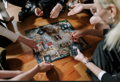 Adults playing Cluedo