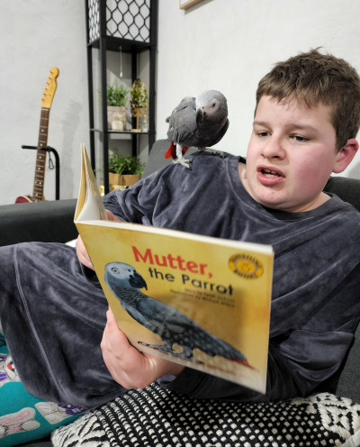 Caden reading to Chikezie