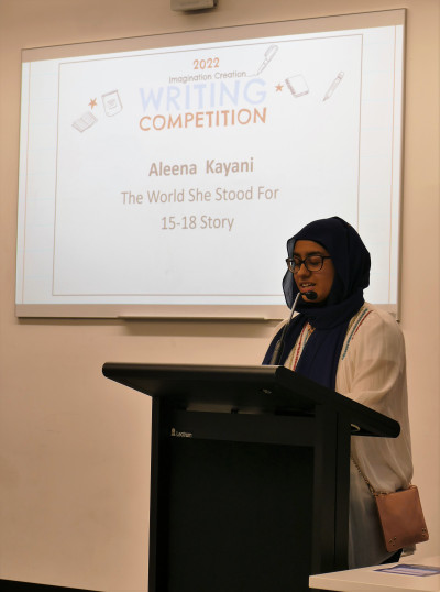 Aleena reading her entry
