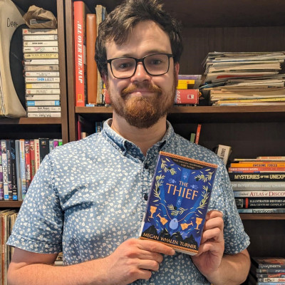 Declan holds a copy of The Thief