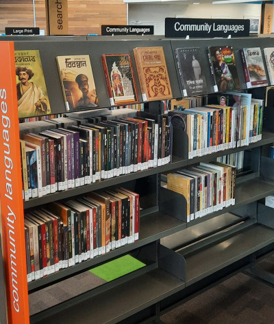 Shelves of books labelled Community Languages