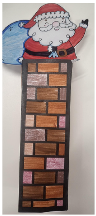 A bookmark of santa in a chimney