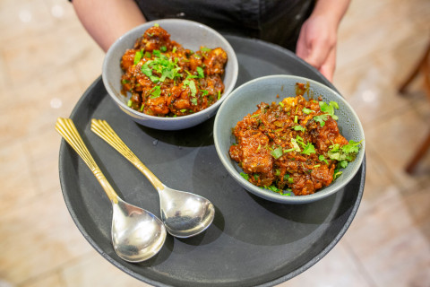 bowls of curry on tray