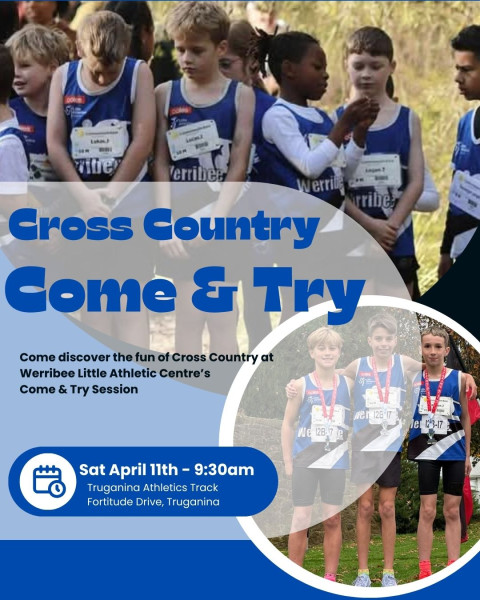 a group of kids in blue and white running vests stand on a start line