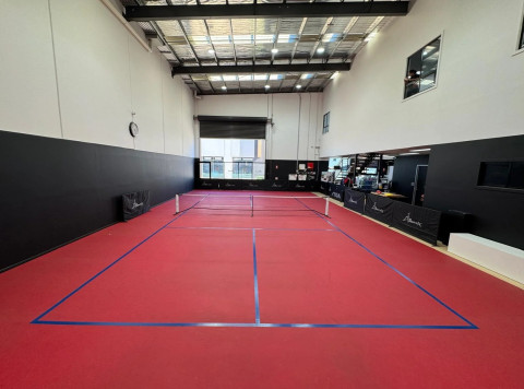 a picture of a red pickleball court