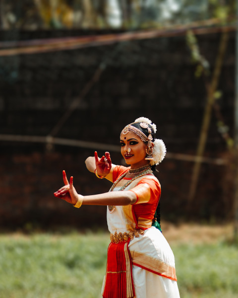 Indian classical Bharatanatyam dancers performing outdoors in vibrant traditional attire