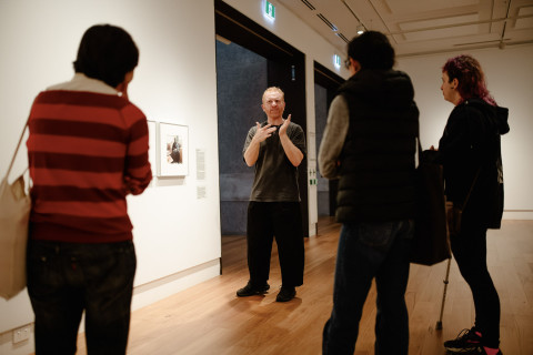 Luke D King provides an exhibition tour in Auslan.