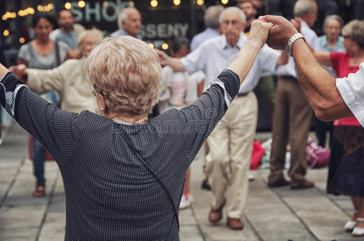 a line of people holding their hands up