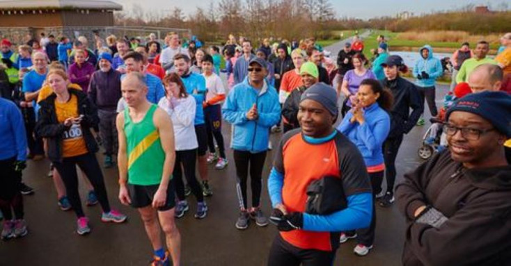 a group of people wearing sports wear are gathered together