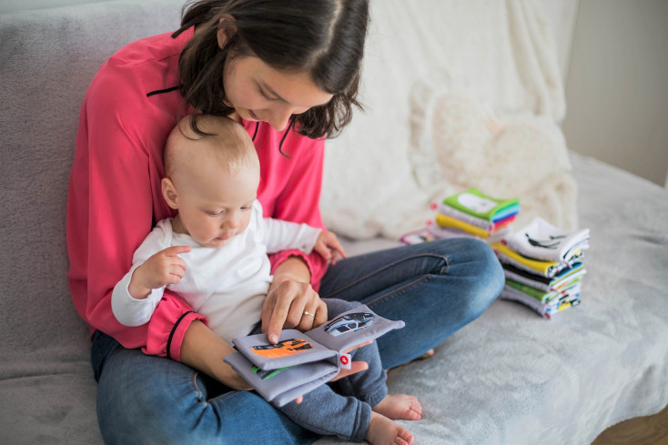 mother reading with baby