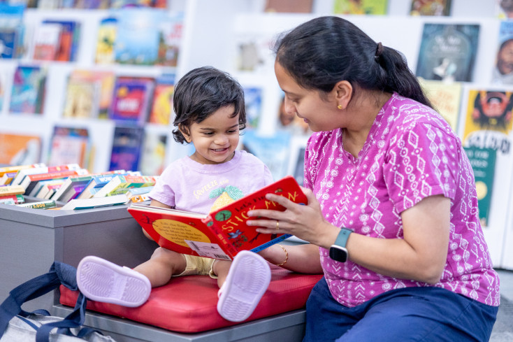 Mother and child reading a story together