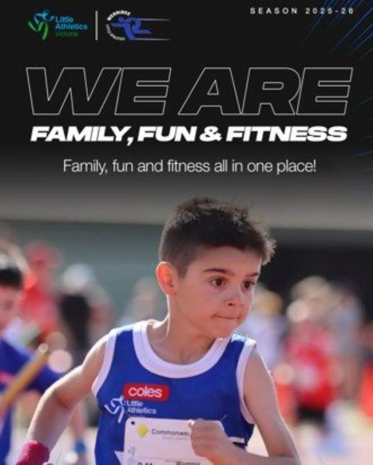 a boy wearing a blue running vest is running on a track