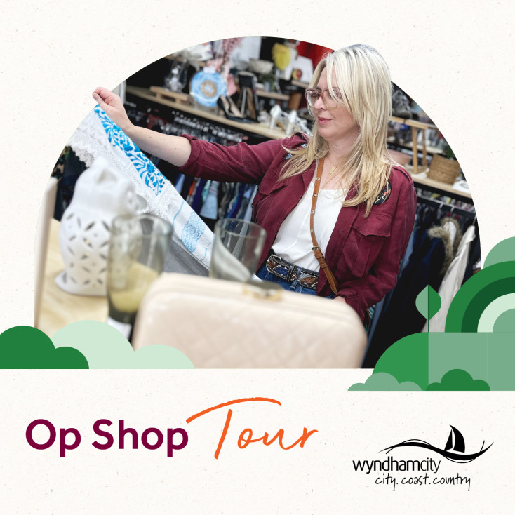 Woman holding up preloved top