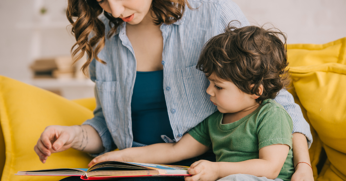 A woman and a child reading a picture book together