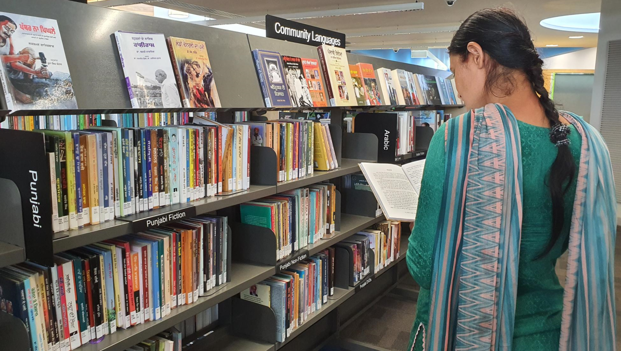 Patron browsing the Punjabi collection @ Tarneit 