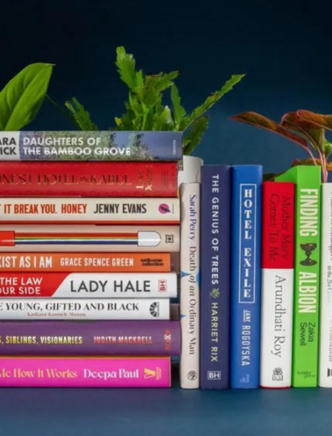 a collection of books stacked together spine out