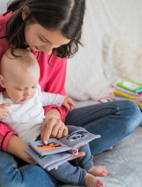 mother reading with baby