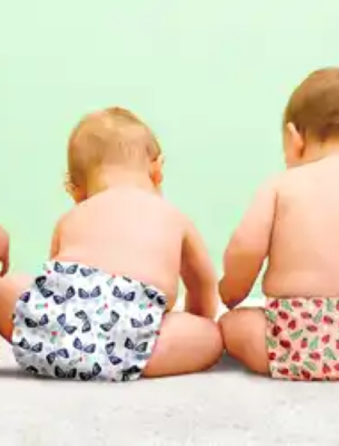 Babies sitting in their cloth nappies 