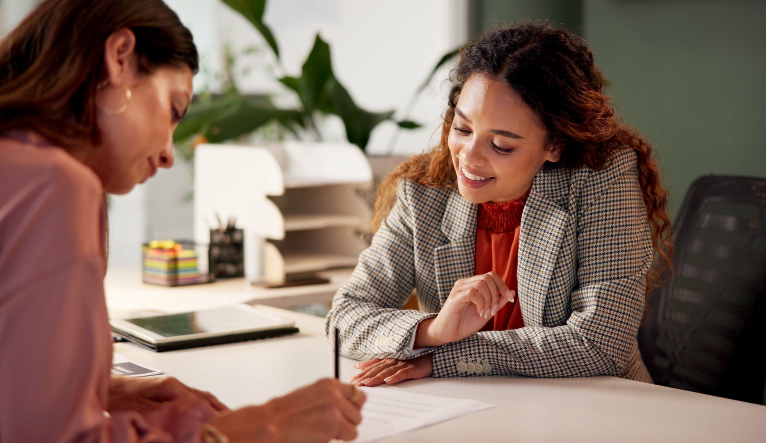 Two women working at a desk