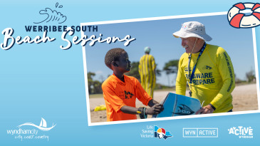 a man wearing a yellow sun safe top and hat is talking to a child wearing an orange sun safe top at the beach