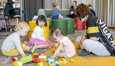 Small children and parents playing with Duplo at Williams Landing