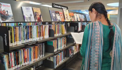 Patron browsing the Punjabi collection @ Tarneit 