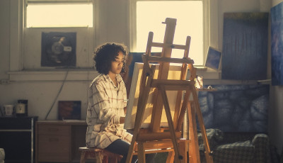 young person with an easel