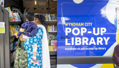 A patron looks at books in the pop up library van