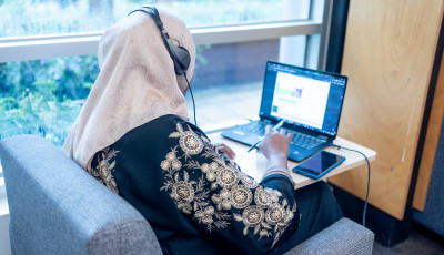 using a laptop at the library