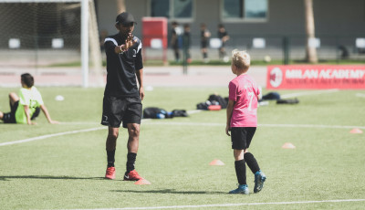Coach talking to young player