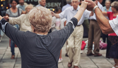 a line of people holding their hands up