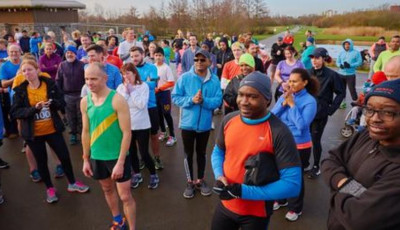 a group of people wearing sports wear are gathered together