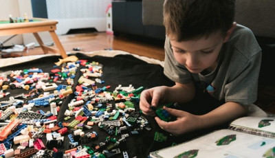 Young boy playing with LEGO