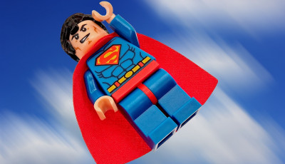 Lego superman flying through the air