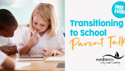 2 children looking at school work