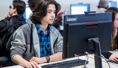 young boy in front of computer